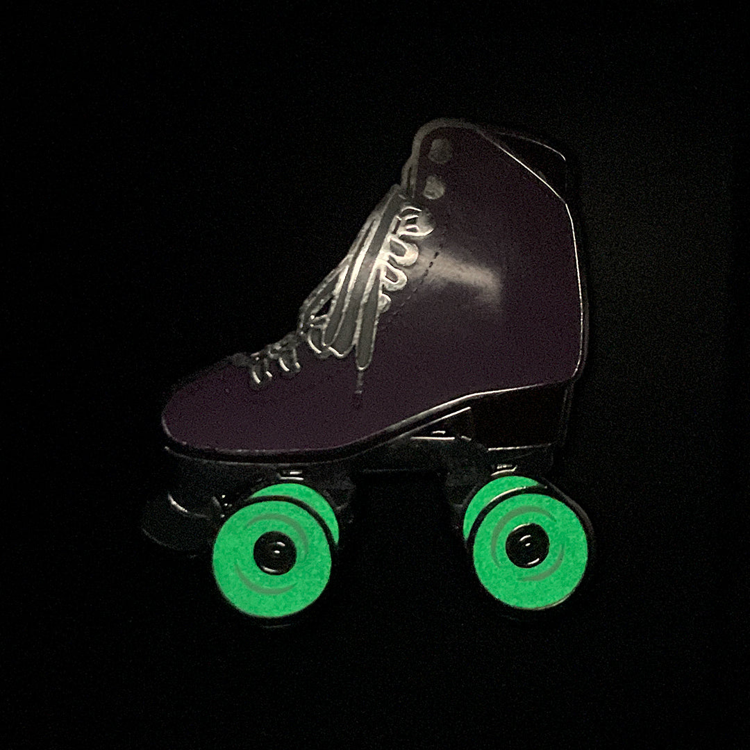 Amethyst roller skate pin with glow in the dark wheels