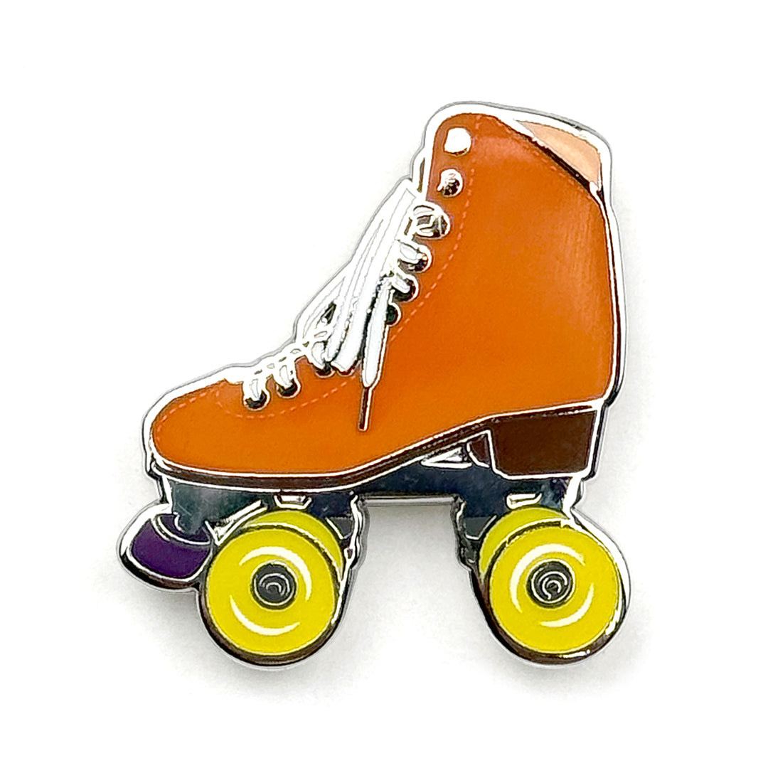 Orange roller skate pin with glow in the dark wheels