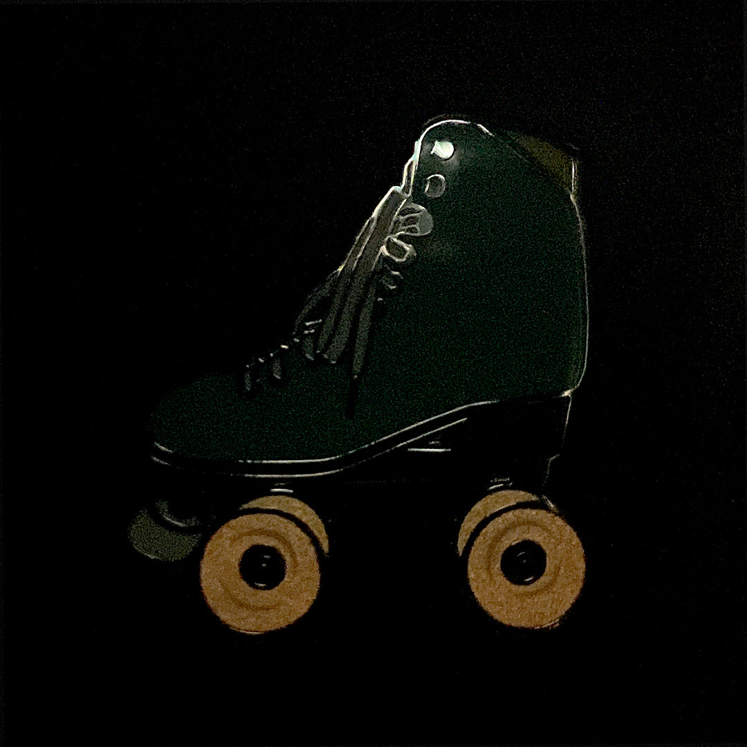 Sea Foam roller skate pin with glow in the dark wheels