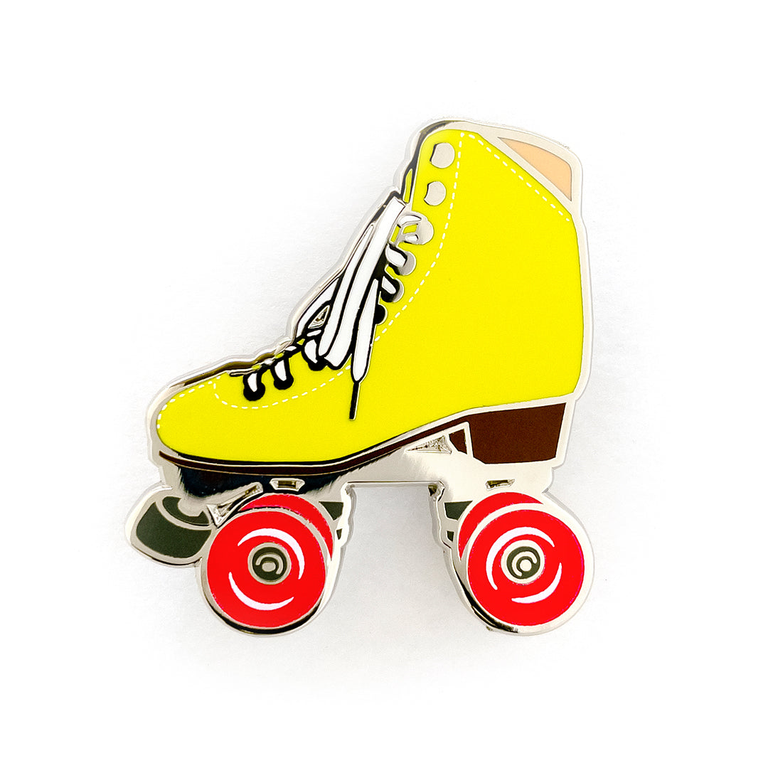 Yellow roller skate pin with glow in the dark wheels